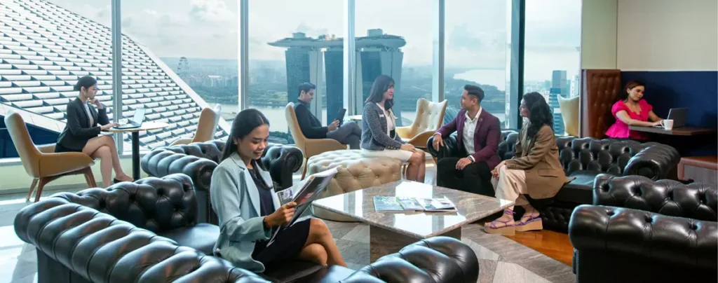 Professionals collaborating inside a coworking space Singapore with modern office design and flexible workstations