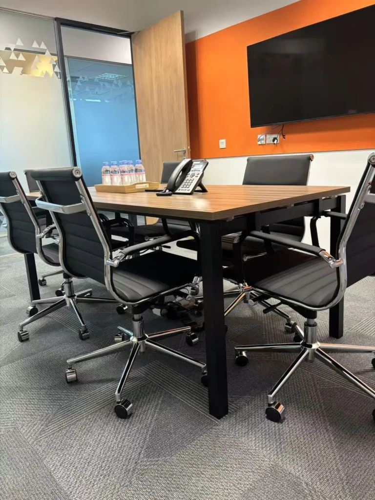 Meeting room in a serviced office in Singapore equipped for client presentations and video conferencing
