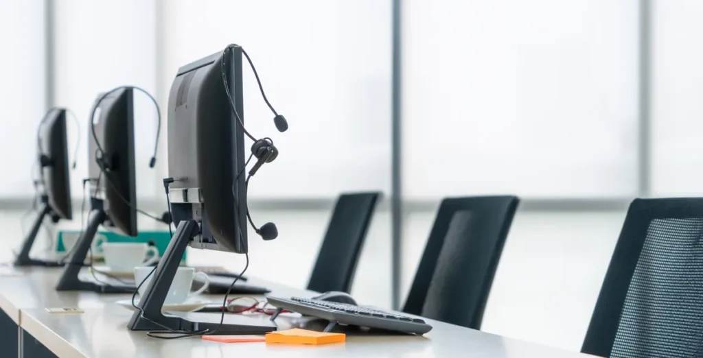 Customer service team at C‑Work assisting entrepreneurs with entrepreneur visa Singapore support in a modern office environment